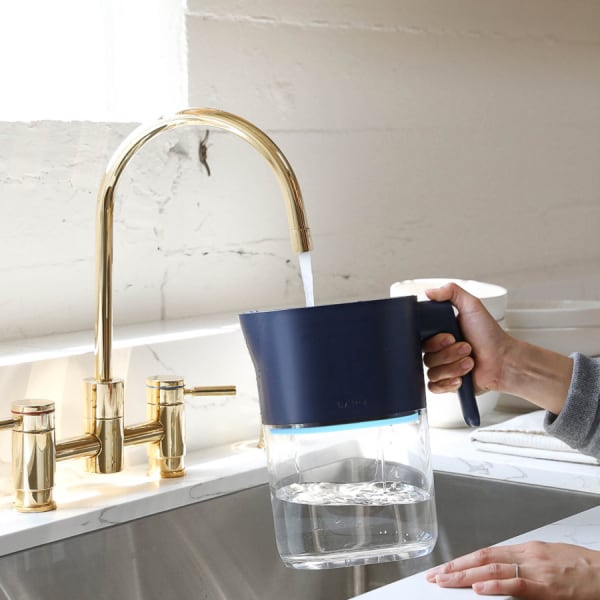 Photo of Larq Pitcher PureVis&trade; - Monaco Blue under a kitchen water tap
