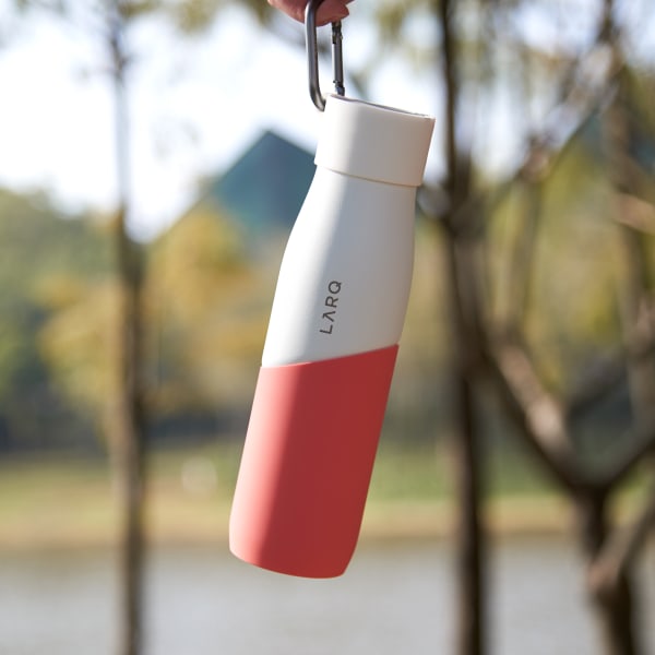 Photo of Active Loop with LARQ Bottle PureVis&trade; White/Coral hanging on a finger