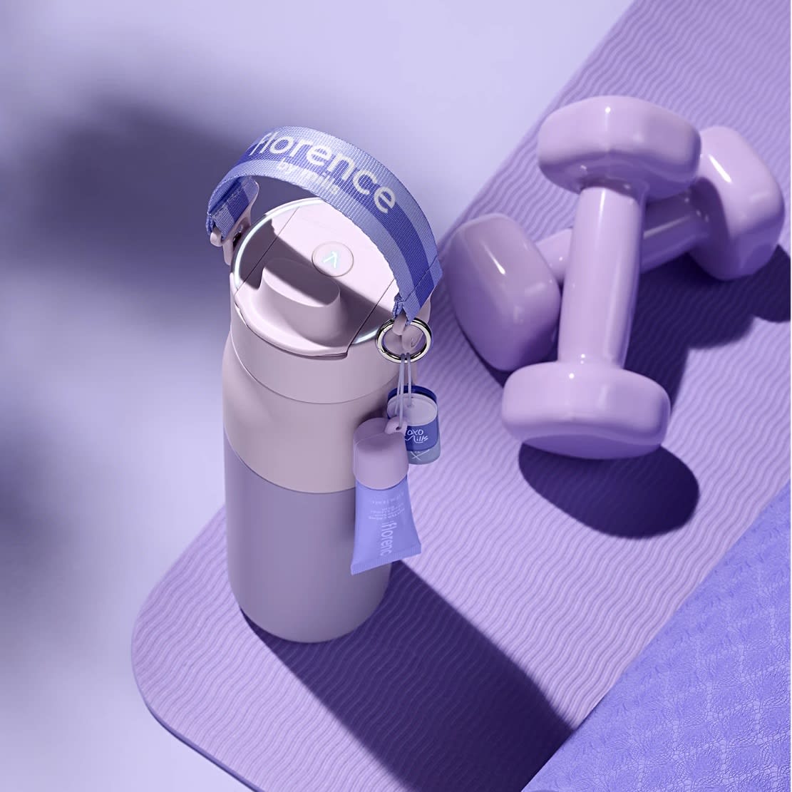 LARQ Bottle PureVis&trade; 2 in florence by mills purple on a yoga mat beside lavender dumbbells