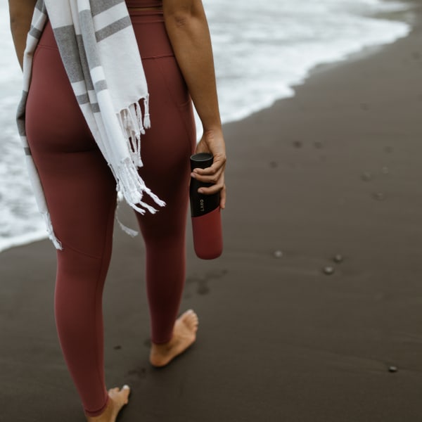 Photo of Larq Bottle PureVis&trade; - Black / Clay on beach