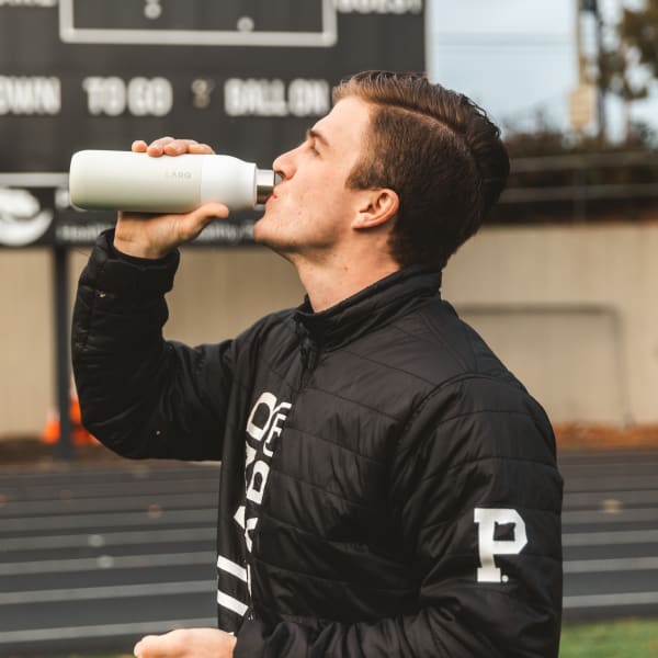 Photo of man drinking LARQ Bottle PureVis&trade; - Granite White