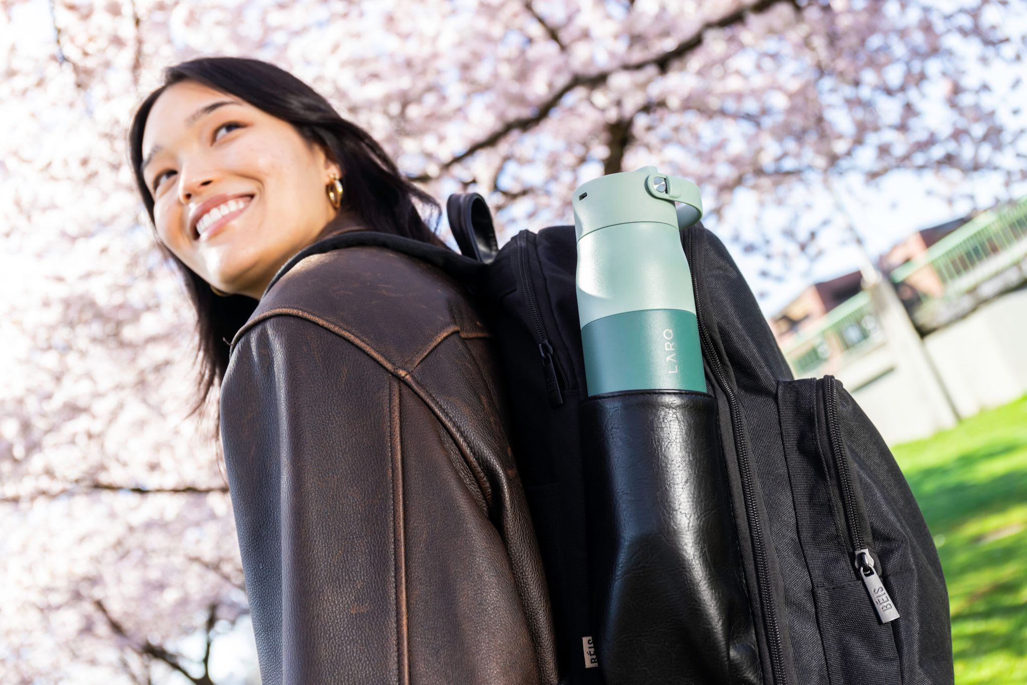 Woman walking with a LARQ Bottle PureVis&trade; 2 in her backpack.