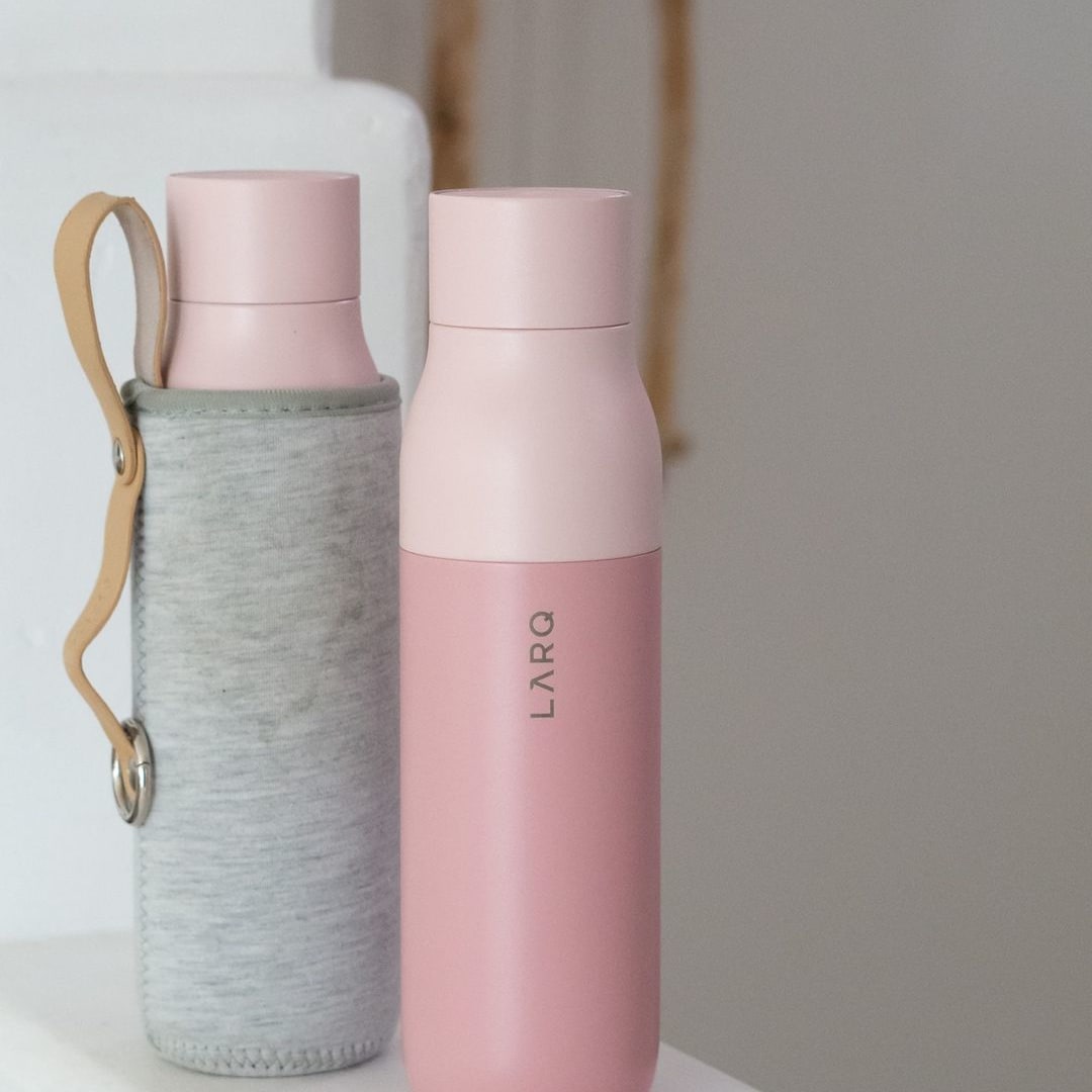 Photo of LARQ Bottle PureVis&trade; - Himalayan Pink in Travel Sleeve on staircase