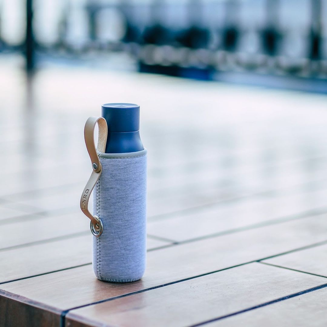 Photo of LARQ Bottle PureVis&trade; - Monaco Blue in Travel Sleeve on wooden floor