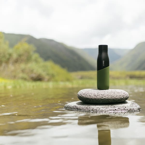 Photo of Larq Bottle PureVis&trade; - Black / Pine on a rock in water